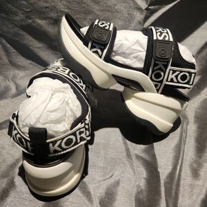 Michael Kors • Maverick Sport Wedge Sandals Black & White Embossed Logo Size 6